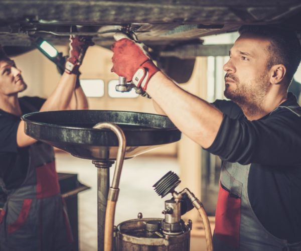 Mechanics Fixing Car